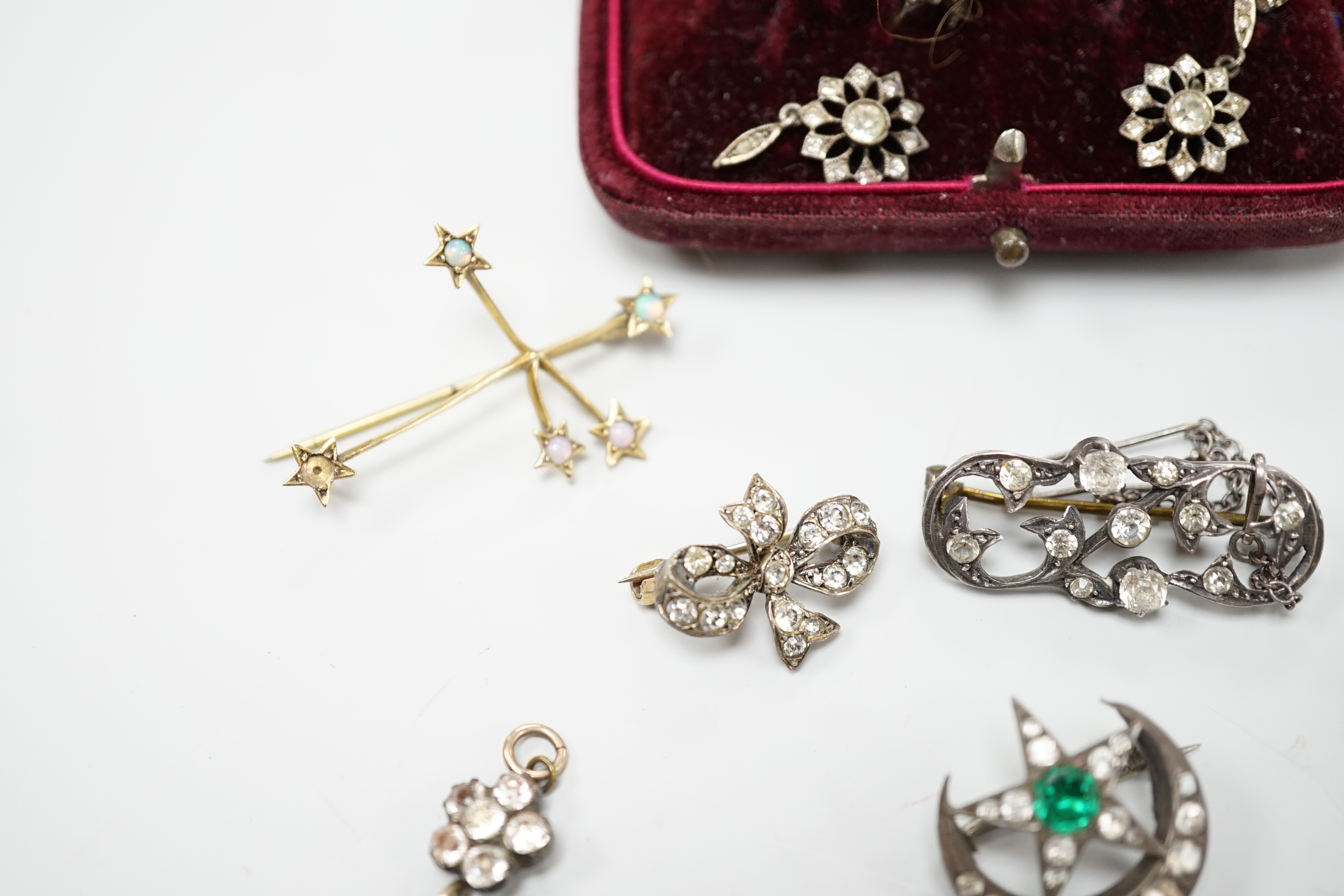 A group of mainly paste set jewellery including a pair of 9ct gold, silver and paste drop earrings and an opal set constellation brooch